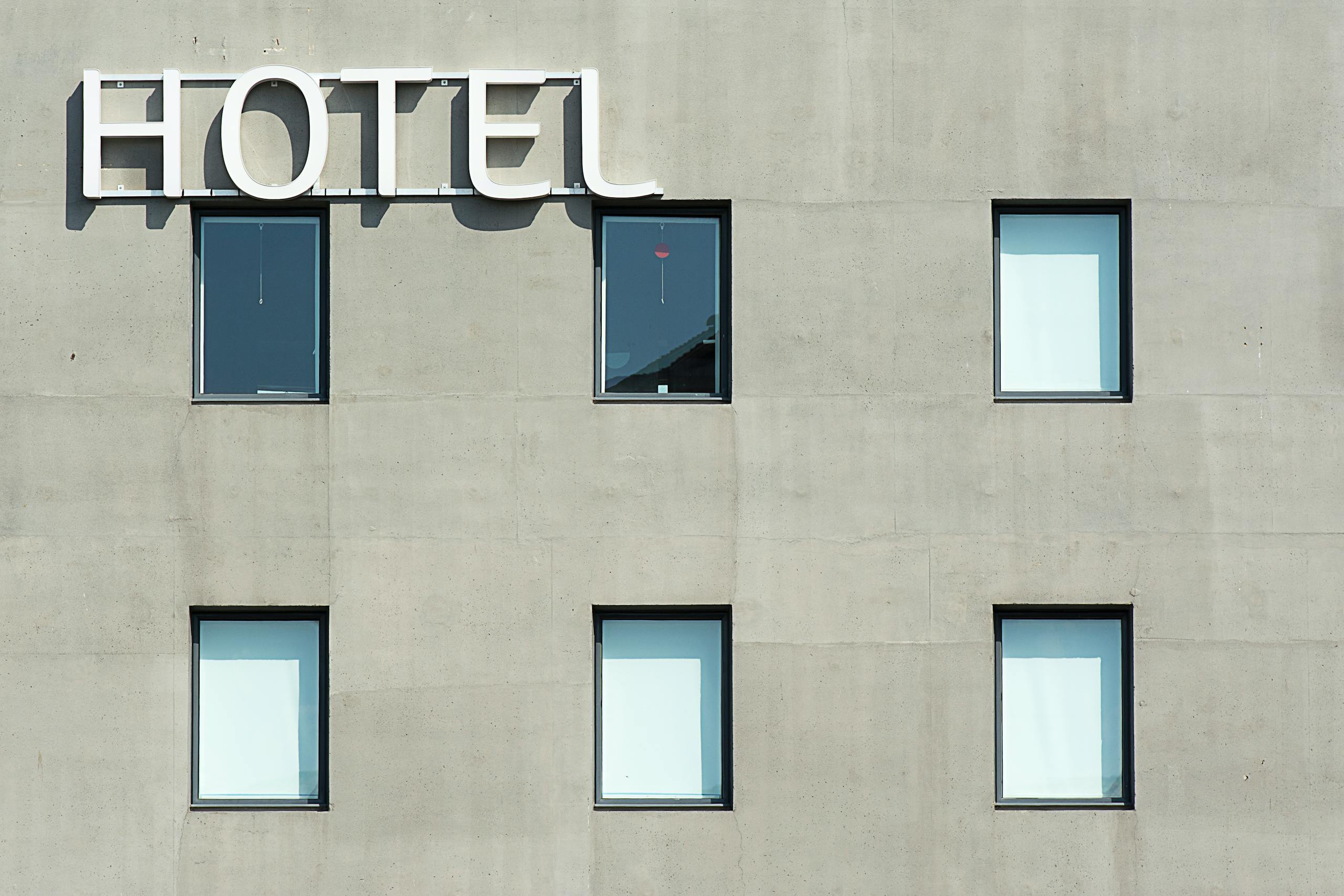 The Essential Cruise Shop Blog - Contemporary hotel facade featuring minimalist design and geometric window patterns.